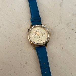 Gold and teal Coach watch. Beautiful and timeless statement piece.